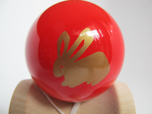 Red tama with rabbit in gold.