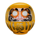 Yellow daruma doll from Japan.