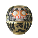 Large gold daruma.