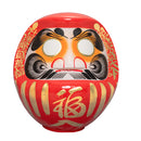 Large red daruma doll.