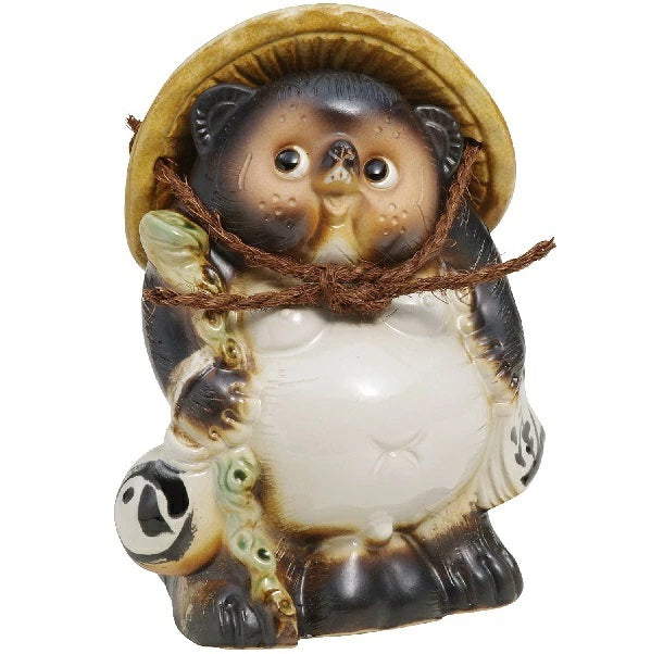 Tanuki with walking stick.