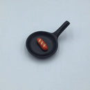 Frying pan with sausage.