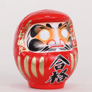 Success daruma in red.