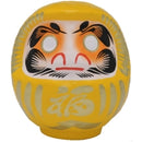 Yellow daruma doll.