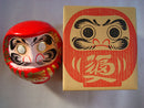 Red daruma doll.