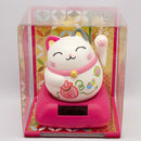Solar maneki in plastic case.