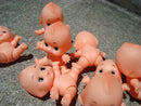 Sitting Kewpie (set of 10).