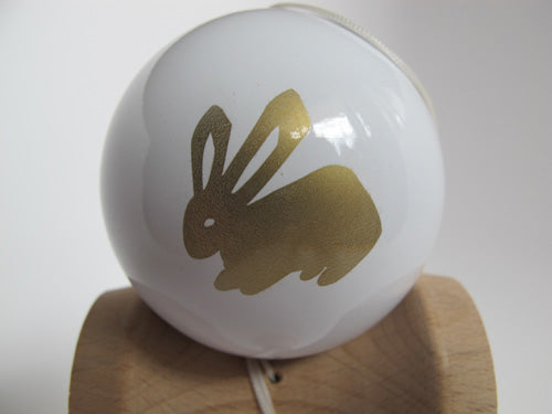 White tama with rabbit in gold.